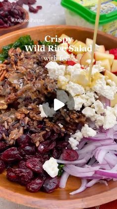 a bowl filled with lots of food on top of a table