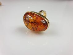 Amber ring. Brown cognac Amber. Certificated Sterling silver 925 with stamps. Big nice stunning ring. Adjustable size. weight 14.10 gr Stone size- 3.5x 2.2 cm This item was made of natural Baltic Amber. All the amber used in my jewelry is collected in my home country Lithuania. I sell only genuine, real, not pressed, authentic, natural Baltic Amber. Item may have natural imperfections. Due to amber being natural, each of my jewelry is unique and even the same models can be slightly different. Pl Multicolor Earrings, Amber Earrings, Amber Ring, Natural Amber, Amber Necklace, Amber Beads, Amber Jewelry, Unisex Ring, Plated Ring