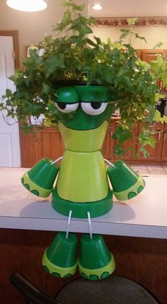 a green planter sitting on top of a counter