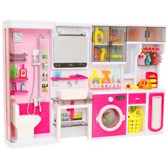 a dollhouse bathroom with sink, toilet and washing machine