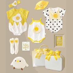 Buy a gift that new parents are going to be thrilled to receive. This gift bundle featuring baby rompers with egg yolk design, headband, socks, photo frame, soft toy and more is sure to please. The bundle comes neatly packed in a suitcase for added cuteness! Fabric: Cotton Inclusions: Set A and Set B3 Rompers1 Hat1 Headband1 Pair of Sock1 Stuff TotFram and Suitcase Set C and Set D2 Baby Outfits1 Hat1 Headband1 Pair of Sock1 Stuff TotFram and Suitcase Playful Sets For Easter Playtime, Cute White Easter Sets, Cute White Easter Outfit Set, Playful White Sets For First Birthday, Gift Bundle, Baby Rompers, Suitcase Set, Gift Bundles, Baby Gift Sets