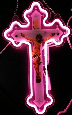 a neon lit cross with jesus on it