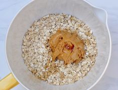 a bowl filled with oats and peanut butter