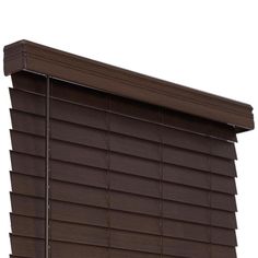 a close up view of a window with brown blinds on the top and bottom side