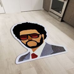 a floor mat with an image of a man wearing sunglasses