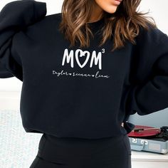 Our mama tshirt is the perfect gift for all moms! Personalize with the names of the mother's children or loved ones to make it even more special.  T-Shirt Comfort Colors: ☆ 100% ring-spun cotton ☆ Fabric weight: 6.1 oz/yd² (206.8 g/m²) ☆ Garment-dyed ☆ Relaxed fit ☆7/8″ double-needle topstitched collar ☆ Twill-taped neck and shoulders for extra durability ☆ Double-needle armhole, sleeve, and bottom hems T-Shirt Bella Canvas: ☆100% Airlume combed and ringspun cotton (fiber content may vary for di Children Names, Mama Tshirts, Mothers Day Shirts, Mama Shirt, Mother And Child, Mom Shirt, Graphic Tees Women, Kid Names, Mom Shirts