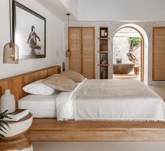 a bed sitting in a bedroom next to a doorway