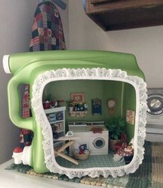 a green and white microwave oven sitting on top of a counter next to a washing machine