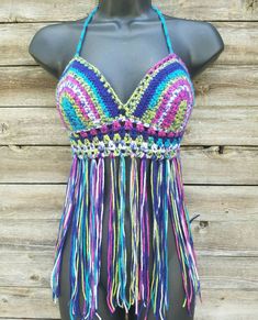 This super comfortable crochet bikini top is perfect for lounging at your favorite summer festival. It is made with 100% acrylic yarn in varying rainbow colors of lime green, pink, dark purple, and blue. Laces up the back and ties around the neck. Custom made to fit your size and measurements. Want padding added? Add this listing to your order and choose from either push up or regular foam padding. https://www.etsy.com/listing/399021473/add-padding-to-your-crochet-top Festival Crochet Stretch Swimwear, Bohemian Fitted Swimwear For Festival, Bohemian Fitted Festival Swimwear, Bohemian Green Swimwear For Festivals, Fun Fitted Beach Top, Rave Style Swimwear For Beach Festival, Rave Swimwear For Beach Festival, Rave Festival Swimwear For Beach Season, Beachy Crochet Top For Festival