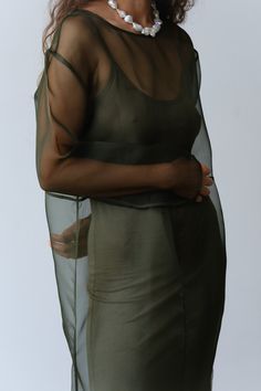 The Organza Dress is crafted from 100% silk and features, piping details throughout, side slits at the bottom, and a boxy fit. 
Please note this is a sheer style as intended. We love to layer it with The Jersey Slip Dress for coverage. 
Made in Los Angeles Silk Overlay Dress, Sheer Silk Dress, Sheer Dress Outfit, Insect Dress, Organza Outfit, Sheer Overlay Dress, Dress Layering, Changing Clothes, Dress Organza