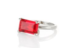 A slim rectangular stone set horizontally in high-polish prongs is what this unique Ruby ring beautifully flaunts. This July birthstone brings a vivid charm that you can wear or wrap as a gift for a special occasion. This lovely piece can be styled with other handmade rings or worn on its own. Exquisite jewelry piece. Breathtaking gemstone piece. Charming choice for a promise or engagement ring. Classy and chic jewelry ring. Ring size is customizable. Product specifications Jewelry Information M