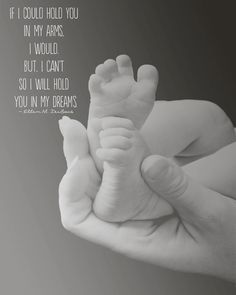 a hand holding a baby's foot with the words if i could hold you in my arms