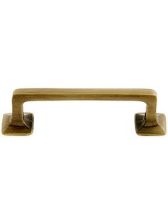 an antique brass pull handle on a white background