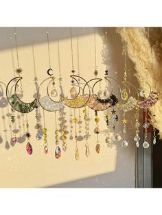 there are many different necklaces hanging on the wall