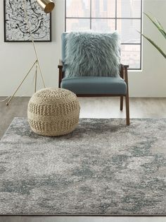 a living room with a chair and rug