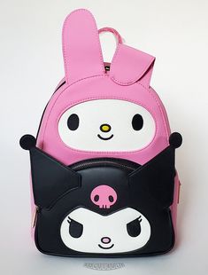 This is a Loungefly Hello Kitty - My Melody and Kuromi mini backpack.  This smooth and supple leather backpack features My Melody and Kuromi cosplay characters in pink and black with glitter and embroidered faces.  The backpack is lined in pink fabric with a print of My Melody and Kuromi.  A zippered pouch reside behind Kuromi and convenient drop pockets are on each side.  The padded shoulder straps are adjustable and the sturdy hardware is gold chrome.  A beautiful backpack!  Check out our list Cute Halloween Travel Backpack, Cute Backpack For Back To School And Theme Park, Themed Black Backpack For Theme Parks, Kawaii Hello Kitty Backpack For Travel, Kawaii Hello Kitty Travel Backpack, Cute Halloween Backpack For Everyday Use, Harajuku Style Pink Bag For Cosplay, Black Cartoon Backpack For Students, Black Character Backpack For Everyday Use