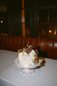 a white cake sitting on top of a table