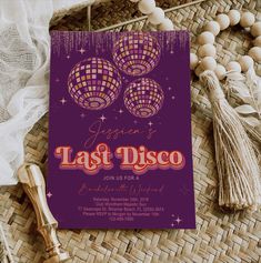 a purple and gold disco themed birthday party card with tassels, beads, and other accessories