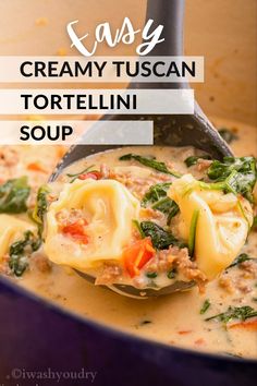 creamy tuscani tortellini soup in a blue pot with a ladle