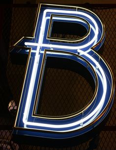 the illuminated letter b is lit up in blue