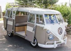 an old vw bus is parked on the street