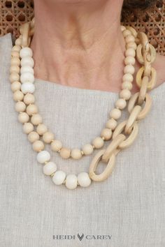 Ivory Marnalis Hardwood Chain. Long beaded necklace, white marmalis and hardwood chain. Can be worn or long wrapped around twice. This chunky necklace can be worn this spring season. Statement accessory to add to your spring-summer outfit. Handmade jewelry can be the perfect gift for women over 40 who love fashion. #HeidiCareyCollection #HeidiCareyNecklace #handmadeJewelry #statementjewelry #beadednecklace #springaccessories #springstyle Elegant Double Strand Necklace With Large Beads, Elegant Beige Beaded Necklaces With Large Beads, Elegant Beige Beaded Necklace With Large Beads, Elegant Cream Necklaces With Large Beads, Elegant White Jewelry With Wooden Beads, Beige Beaded Chain Necklace With Round Beads, Elegant Multi-strand Necklace With Wooden Beads, Elegant Multi-strand Necklaces With Wooden Beads, Elegant Beige Beaded Chain Necklace