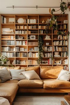 a living room filled with lots of furniture and bookshelves