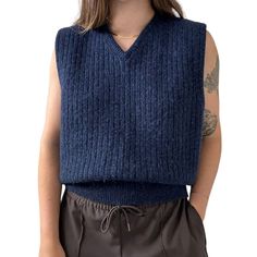 Vintage Mens Eddie Bauer Navy Blue 100% Wool Ribbed Preppy Sweater Vest Sz L Unisex  Size L Color: navy blue  Material: 100% wool Excellent vintage condition  Collar to hem: 26'  Pit to pit: 22"  Modeled on a medium/size 6/ 5 foot 7/ 140lbs/ 34 C/ 28" inch waist Blue Knit Vest For Fall, Navy Wool Tops For Fall, Blue Sweater Vest For Fall, Wool Crew Neck Sweater Vest For Fall, Fall Wool Sweater Vest With Crew Neck, Navy Wool Sweater For Fall, Blue Merino Wool Top For Fall, Navy Wool Winter Tops, Navy Ribbed Sweater For Winter