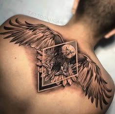 an eagle tattoo on the back of a man's shoulder