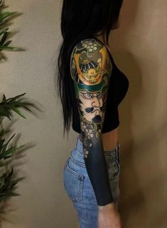 a woman with a tattoo on her arm