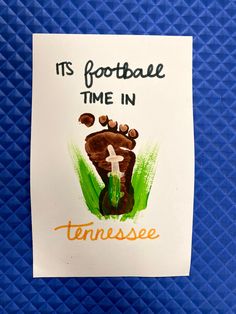 it's football time in tennessee handprinted on a piece of paper