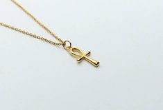 Ankh necklace ,Egyptian ankh jewelry, ankh gold necklace, dainty necklace gold , 24k gold plated necklace, Egyptian cross of life The ankh or key of life is an ancient Egyptian hieroglyphic symbol that was most commonly used in writing and in Egyptian art to represent the word for life and by extension as a symbol of life itself. These beautiful ankh gold necklaces are so simple minimalistic and represent so much in a simple teardrop cross. Made from 24k plated stainless steel designed with the Handmade Ankh Gold Necklace, Handmade Gold Ankh Necklace, Gold Ankh Necklace With Adjustable Chain, Gold Ankh Necklace Gift, Ankh Necklace With Adjustable Chain For Gift, Gold Ankh Necklace For Gift, Spiritual Ankh Cross Necklace Gift, Elegant Gold Handmade Cross Necklace, Elegant Handmade Gold Cross Necklace