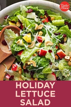 a salad with lettuce, cranberries and nuts in it