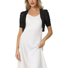 Sheer and Stylish: Our Casual Short Sleeve Mesh Sheer Shrug adds an extra layer of style to any outfit. The sheer fabric creates a delicate and feminine look, perfect for adding a touch of elegance to your attire. Versatile Open Front Design: The open front design of this shrug allows for easy layering and adds a chic element to your ensemble. Wear it over a dress, tank top, or blouse for a stylish finishing touch. Comfortable Short Sleeves: The short sleeves provide just the right amount of cov Black Evening Shrug For Spring, Black Shrug For Evening In Spring, Black Spring Evening Shrug, Fitted Black Summer Shrug, Fitted Black Shrug For Summer, Black Fitted Shrug For Summer, Black Shrug For Spring Layering, Elegant Black Shrug For Spring, Black Shrug For Spring