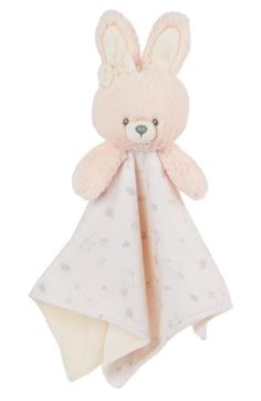 a pink teddy bear with a white blanket on it's back and ears hanging from the