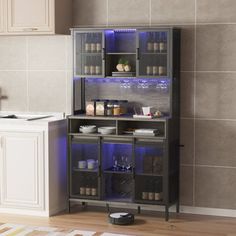 a kitchen area with a counter, cabinets and a stove top oven on the floor