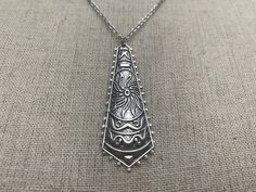 "Unique, funky and stylish boho pendant necklace. It has incredible detail and design. This is a very versatile piece and would be perfect for everyday wear. The pendant measures 2\" long by 3/4\" wide. Made from allergy free plated silver. It hangs from a shiny strong 18\" stainless steel necklace chain with a lobster clasp. I have matching earrings in my shop if you would like the whole set. Here is a direct link https://etsy.me/31dVEuN Thanks for stopping by! Please take a moment and visit th Bohemian Nickel-free Pendant Necklace, Nickel Free Hippie Necklaces For Festivals, Nickel Free Bohemian Necklace For Festivals, Bohemian Nickel-free Necklace For Festivals, Nickel-free Bohemian Necklace For Festival, Hippie Style Nickel-free Necklaces For Festivals, Hippie Nickel-free Necklaces For Festivals, Bohemian Nickel-free Necklaces, Bohemian Handmade Teardrop Pendant Necklace