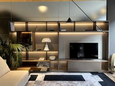 a living room with modern furniture and lighting