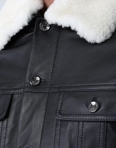 Expertly crafted by Dolce & Gabbana, this quilted lambskin jacket boasts patch pockets, a luxurious fur collar, and secure button fastening. Its sophisticated design premium materials ensure both style functionality. Elevate your wardrobe with timeless piece. Luxury Leather Jacket With Flap Pockets, Luxury Leather Outerwear, Luxury Shearling Outerwear For Work, Luxury Leather Outerwear With Pockets, Luxury Quilted Leather Jacket With Long Sleeves, Designer Winter Outerwear With Flap Pockets, Luxury Leather Jacket With Padded Collar For Work, Luxury Shearling Leather Jacket For Work, Luxury Shearling Outerwear With Padded Collar