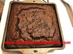 a chocolate cake in a pan on top of a stove