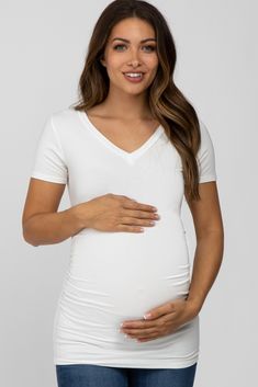 A soft knit maternity top featuring a v-neckline, short sleeves and ruched sides. The Ivory V-Neck Ruched Side Maternity Top is perfectly bump-friendly! Maternity Maxi Dress, Maternity Maxi, Maternity Top, Pregnancy Maxi Dress, Pink Blush Maternity, Maternity Tops, Maternity Fashion, Maternity Dresses, Maternity Clothes