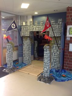 an entrance to a building decorated with flags