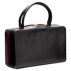 Elegant fine handbag from the great Italian fashion house Gucci from the 1950s-60s. The model shown is a small, rigid, double-handled handbag bauletto. Made of black leather conn central inserts in fiery red leather. Its closure is in gold metal . Inside we find a lining also in the red leather with made several pockets to insert small items. Inside there is also a small coin purse also made of red leather. Inside near the pockets is the original Gucci logo. This small bag is ideal for galas, an Gucci Rectangular Satchel For Evening, Gucci Rectangular Evening Satchel, Rectangular Gucci Satchel For Evening, Gucci Formal Satchel Bag, Gucci Top Handle Evening Satchel, Gucci Leather Evening Satchel, Gucci Leather Satchel For Evening, Gucci Formal Handheld Shoulder Bag, Gucci Handheld Shoulder Bag For Formal Occasions