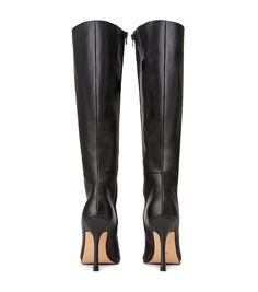 Lending a sleek aesthetic and modern vibes, the Havana knee-high boot is set to impress this AW22. Featuring a slender stiletto heel, an on-trend squared toe and a sleek fitted upper. As a zip-up boot, this style finishes just below the knee. Pair with tucked in pants or a midi-skirt for your next go-to. -Material: ALL NEW Leather Upper & Lining -Sole: Resin sole -Fit: Runs true to size -Toe-shape: Squared -Features: Inner matching zip -Heel: 10.5cm stiletto heel Leg Height x Calf Circumference Luxury Black Calf Leather Heeled Boots, Designer Black Knee-high Heeled Boots, Luxury Tall Black Heeled Boots, Designer Black Calf Leather Knee-high Boots, Slim Calf Boots, Luxury Black Knee-high Boots With Sculpted Heel, Leather Shorts Outfit, Thigh High Boots Flat, Shop Boots Online