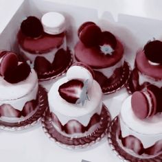 there are many heart shaped cakes in the box