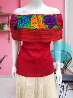 "Mexican Off shoulder top with colorful floral embroidery. Made out of corrugated manta, 100% cotton. Please note: each piece is unique, the embroidery on the top and belt may be slightly different from the one pictured. Dimensions: Small/ Medium Bust- 42\" Length- 22\" Large/ XL Bust- 47\" Length- 23\" 🧵Made in Chiapas, Mexico. 🧺Care Instructions: We recommend hand washing, lay flat to dry. 📲Please feel free to message me with any questions regarding sizing and fit. 📷Additional photos can b Red Folk Tops With Floral Embroidery, Red Embroidered Festival Tops, Bohemian Red Tops With Floral Embroidery, Bohemian Red Tops With Embroidered Hem, Red Floral Embroidered Top For Festival, Bohemian Red Top With Embroidered Hem, Red Tops With Floral Embroidery For Festivals, Red Bohemian Top With Embroidered Hem, Red Bohemian Embroidered Top