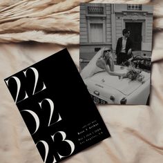 two black and white wedding photos on a bed next to a furnishing area