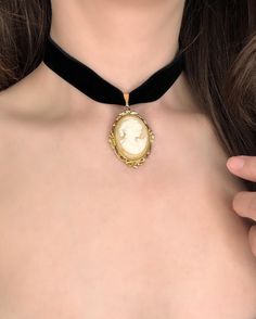 PLEASE READ DESCRIPTION CAREFULLY: Black velvet choker with VINTAGE Whiting & Davis Cameo pendant  ✨ Made with high quality, double sided velvet! Adjustable gold plated brass chain with lobster clasp in back. One size fits most! Materials may not be suitable for those with skin allergies.  These necklaces are not suitable to wear in water, as it will tarnish the quality. Please handle your necklace with care. I find the best way to attach the clasp and chain is from the front of the neck! Once a Elegant Luxury Cameo Necklace, Vintage Cameo Choker Necklace, Cameo Necklace Outfit, Black Dress Gold Jewelry, Evelyn Core, Gold Goth, Cameo Choker, Coquette Jewelry, Silhouette Necklace