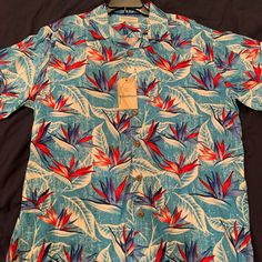 Caribbean Silk Blend Hawaiian Shirt In Blue Turquoise With Birds Of Paradise Flowers. 55% Silk, 45% Rayon. Armpit To Armpit 25”, Length 29 Sizes: Large Blue Short Sleeve Summer Tops, Blue Printed Hawaiian Shirt With Short Sleeves, Blue Tropical Shirt For The Beach, Blue Summer Shirt For Beach, Summer Blue Shirt For Beach, Light Blue Summer Shirt For Vacation, Casual Blue Tops For Vacation, Light Blue Collared Shirt For Vacation, Blue Hawaiian Shirt For Vacation