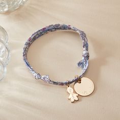 A perfect reminder of unconditional love to treasure. Our Personalized Mommy Liberty Bracelet combines heartfelt charms to represent little ones with the iconic prints of Liberty. Choose between five eye-catching patterns to pair with a smooth disc featuring unforgettable names or dates, and your choice of mini girl &amp; boy charms to match.&nbsp;18K Champagne Gold Plated, 925 Sterling Silver or 18K Rose Gold PlatedCharms measure: 0.6 x 0.6 (Small Flat Disc), 0.5 x 0.3 (Mini Girl, Mini Liberty Bracelet, Iconic Prints, Small Flat, Sliding Knot, Champagne Gold, Hand Engraving, Unconditional Love, 18k Rose Gold, Rose Gold Plates